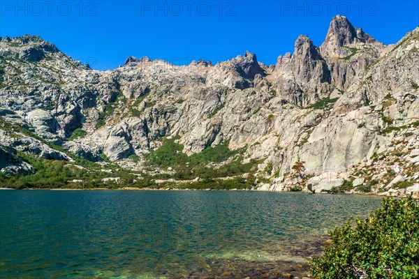 Hiking to the mountain lake Lac de Melo