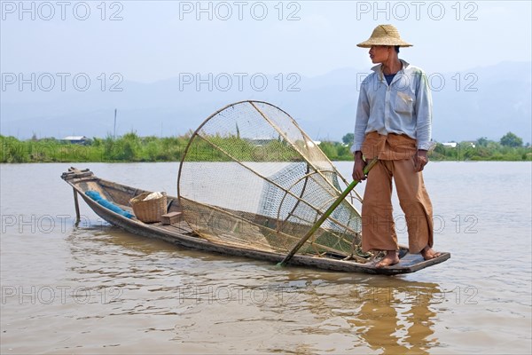 Fishermen with fish trap and nets