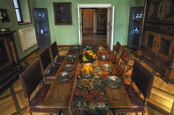 Covered dining table in the dining room of the 16th century Tucherschloss