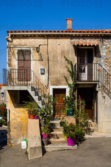 Houses decorated with flowers in Piana in the Calanche