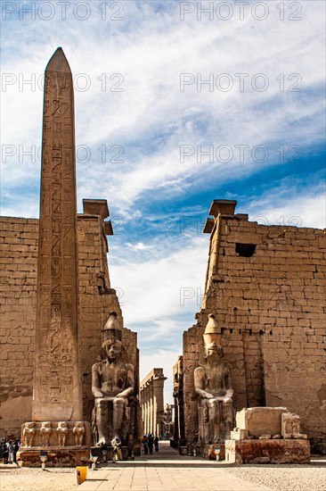 Entrance pylon flanked by two colossal statues of Ramses and obelisk