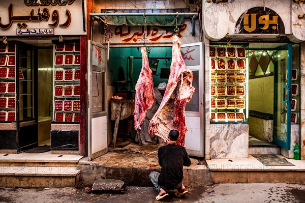 Butcher's shop next to gold jewellery shop