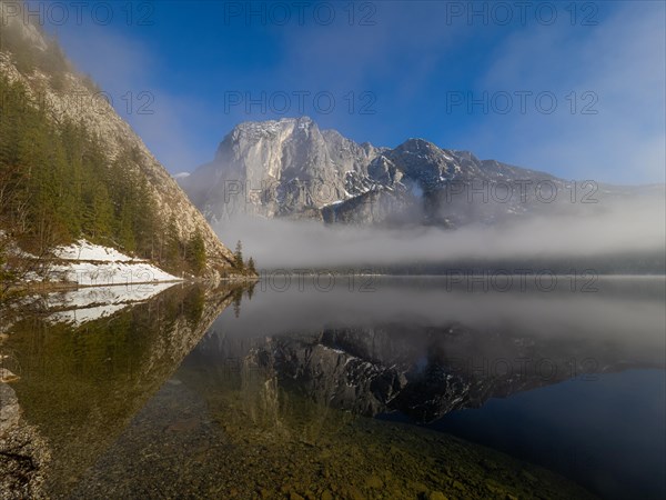 Fog lifts in front of the Trisselwand