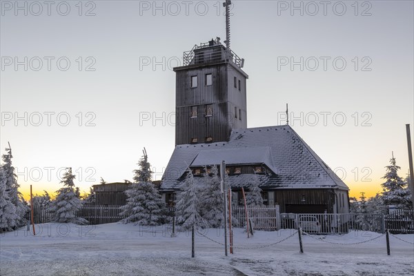 Snowy weather station with arches of lights on the summit of the Fichtelberg