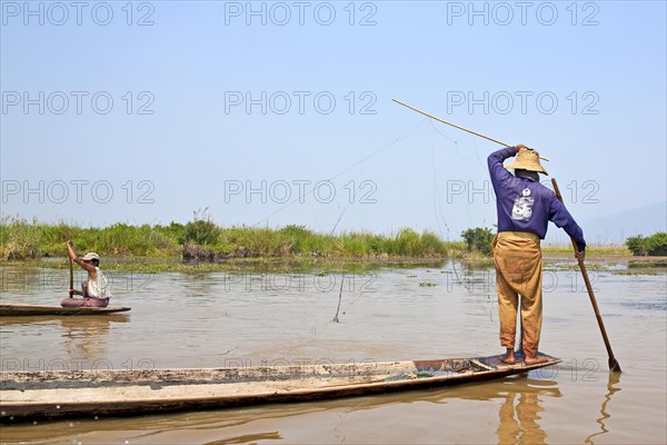 Fishermen with fish trap and nets