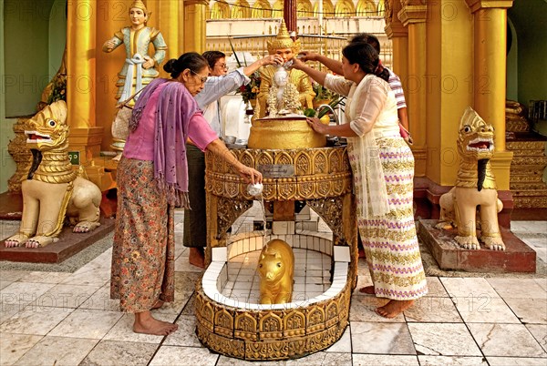 Worshippers at the ceremonial ablution of the Nats