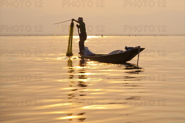 Fishermen with fish trap and nets