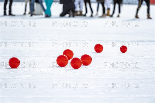 Red polo balls on the field