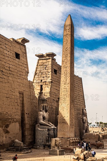 Entrance pylon flanked by two colossal statues of Ramses and obelisk