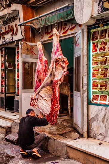 Butcher's shop next to gold jewellery shop