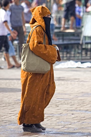 Traditionally dressed woman on the Jemaa El-Fna