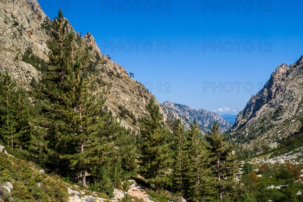 Hiking to the mountain lake Lac de Melo