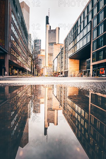 Reflection of the Commerzbank skyscraper or Commerzbank Tower at rain