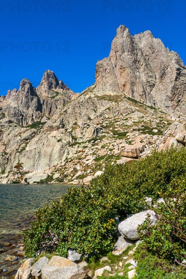 Hiking to the mountain lake Lac de Melo