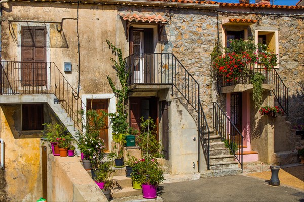 Houses decorated with flowers in Piana in the Calanche