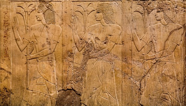 Officials with papyrus stalks