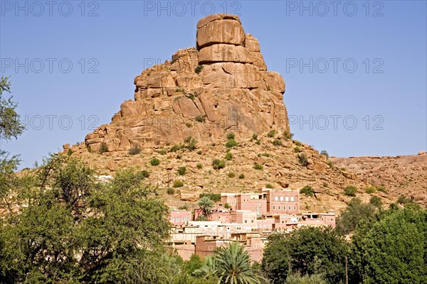 Village in front of bizarre granite rocks