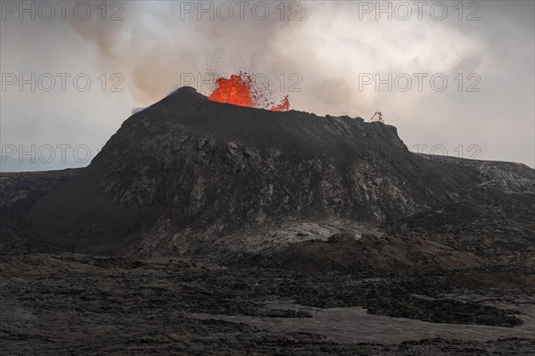 Lava fountain spraying from crater