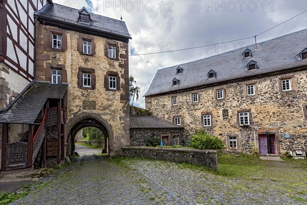 Medieval gate tower of the outer bailey and old tenant's house in the courtyard of Eisenbach Castle