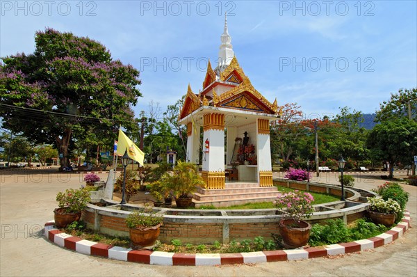 Spiritual Buddhist ghost house Ghost house in centre of roundabout in village