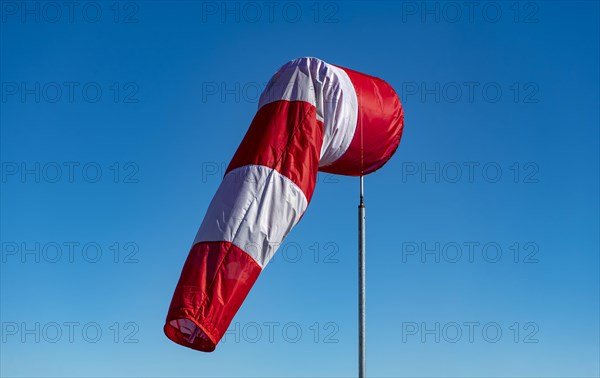 A windsock hangs on a mast at Munich Airport