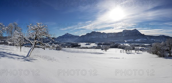 View of snow-covered Mondseeland with Schafberg and Drachenwand