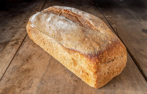 Organic whole wheat bread on a wooden table