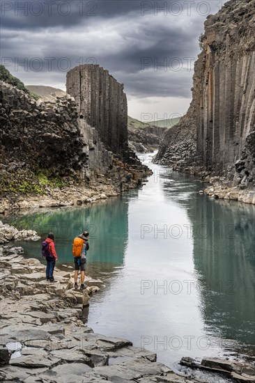 Two tourists in Stuolagil Canyon