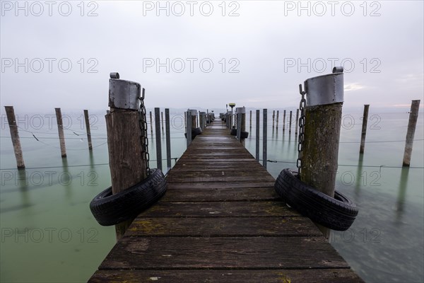 Empty shipping pier in autumn rain