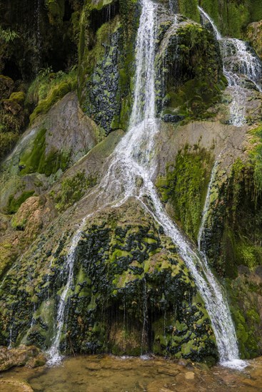 Waterfall and moss-covered rocks