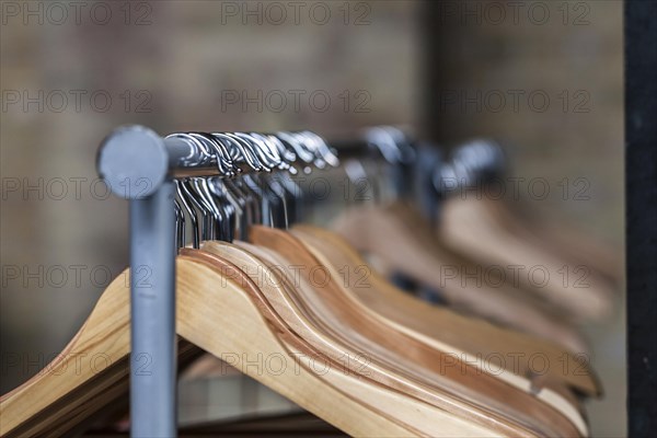 Wooden hanger on a coat rack