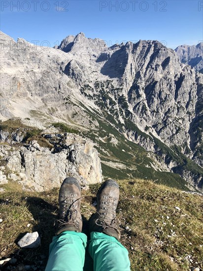 Hiking boots in front of mountain panorama