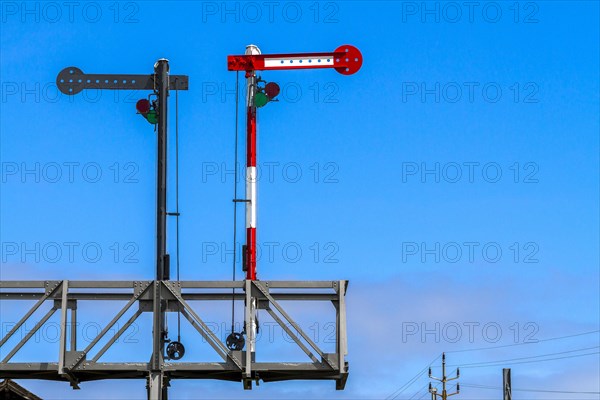 Railway signal against a blue sky