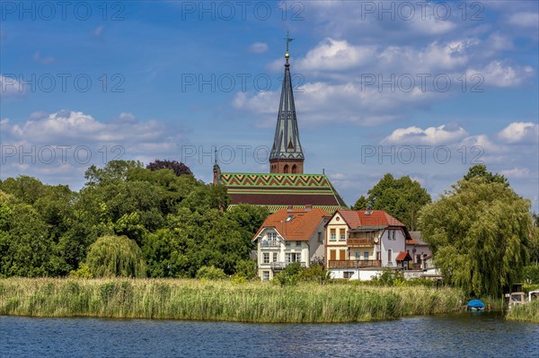 Church and residential buildings on Lake Schwielow near Werder