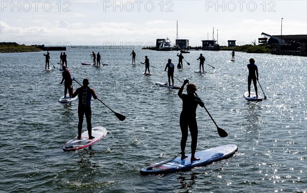 Stand-up paddler on the Hvide Sande Canal