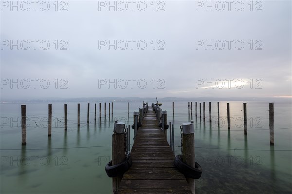 Empty shipping pier in autumn rain