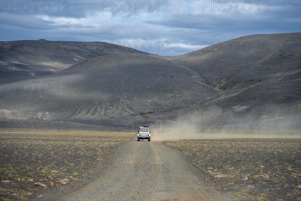 Land Rover Defender on gravel road