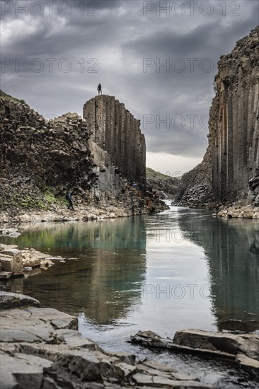 Man standing on rock cliff