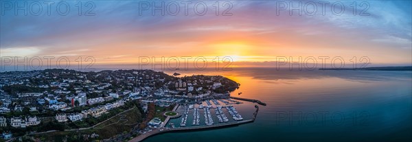 Panorama over Torquay and Torquay Marina from a drone in sunrise time