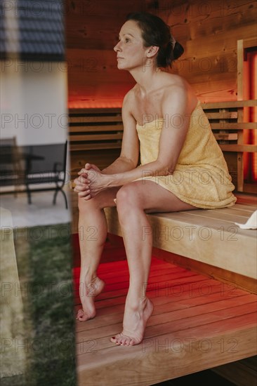 Man with infusion tub in sauna