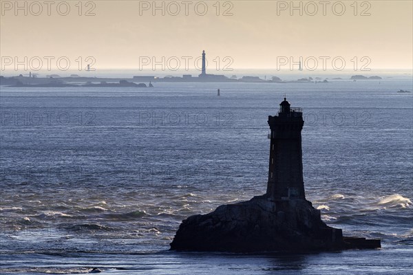 Lighthouse on small rocky island