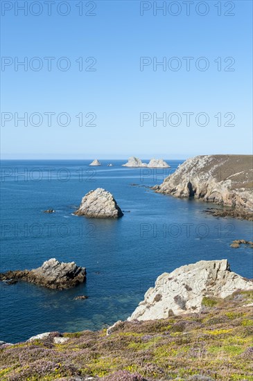 Rock islands in front of rocky coast