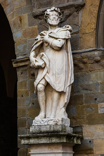 Piazza Vecchia with monument to Italian poet Torquato Tasso in front of Palazzo delle Ragione