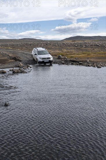 Dacia Duster 4x4 car crossing a river