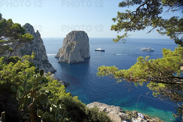 Rocky coast with boats on the sea