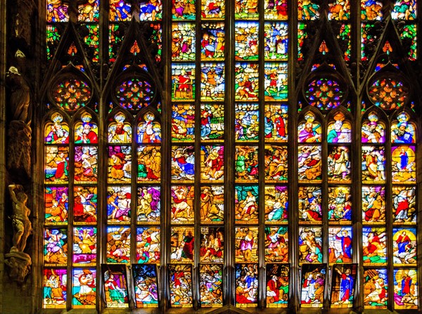 14th century Milan Cathedral stained glass windows in white marble
