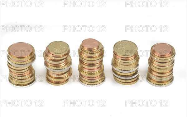 Stack of cent coins and euro coins