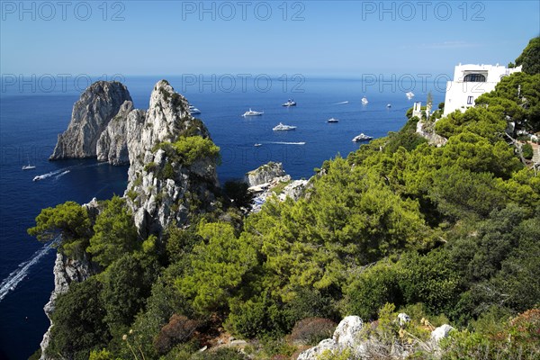 Rocky coast with boats on the sea