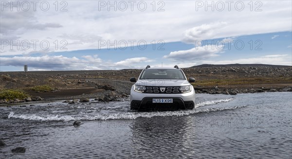 Dacia Duster 4x4 car crossing a river