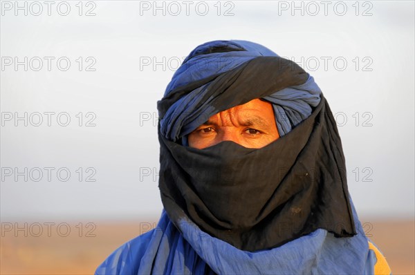 Portrait of a Tuareg with turban in Erg Chebbi